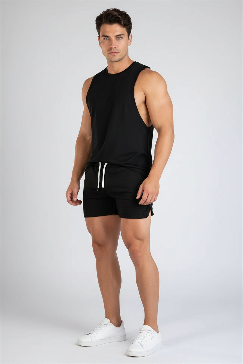 Black shorts worn by a person on a white background