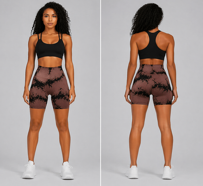 Woman wearing a black sports bra and patterned shorts on a gray background - Aresfit