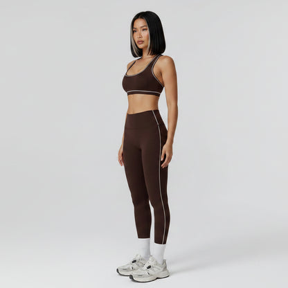 Person wearing a brown sports bra and leggings set on a white background - Aresfit
