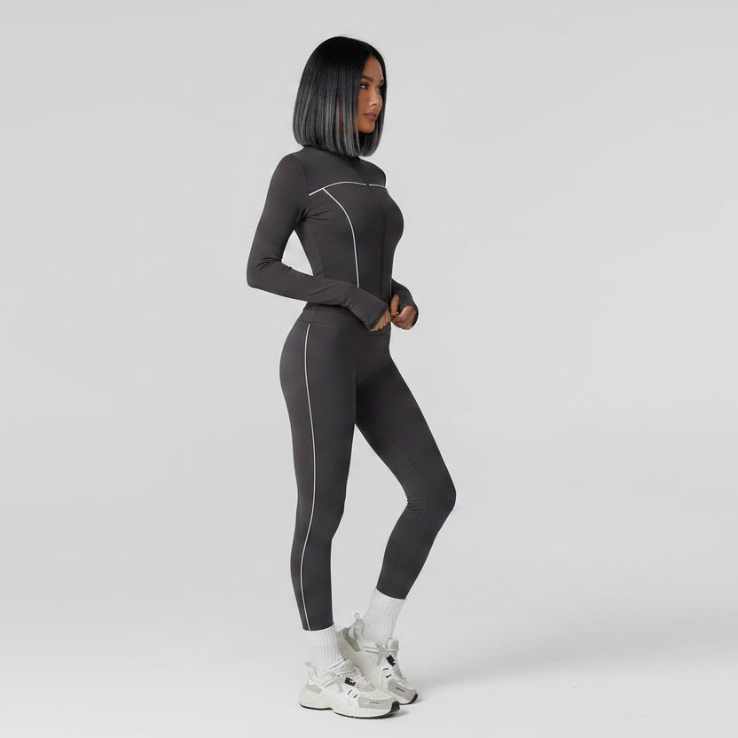 Person wearing a gray full-body suit on a light gray background - Aresfit