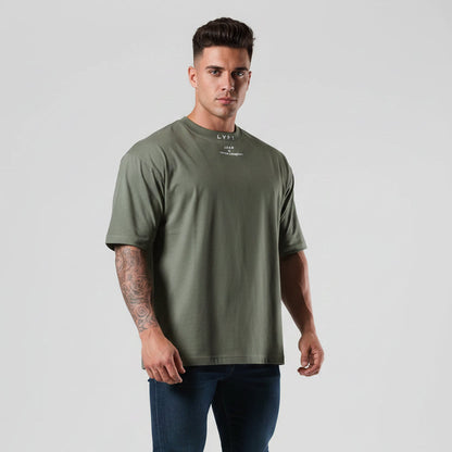 Men's dark sage green oversized cotton gym t-shirt with relaxed fit and minimalist logo design - AresFit