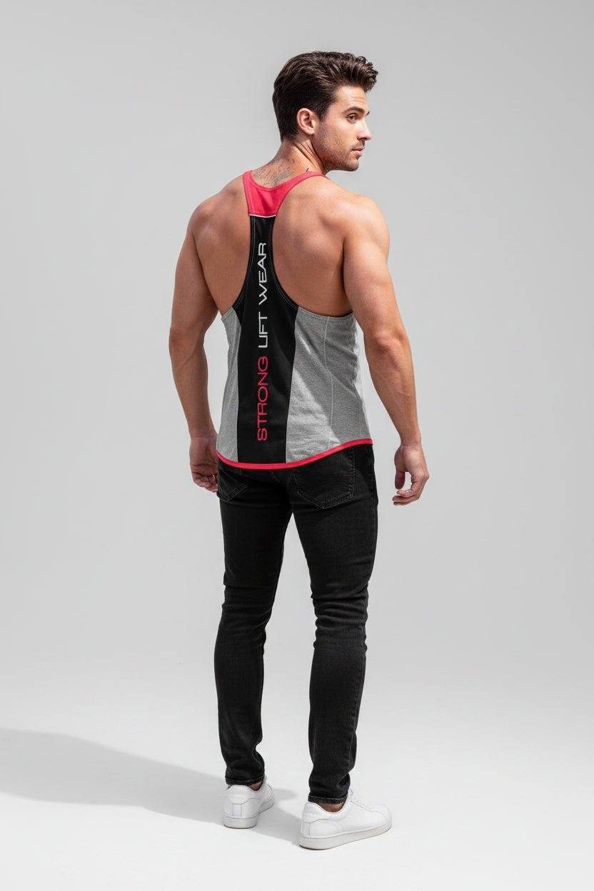 Man wearing a gray tank top with red accents and black pants on a light gray background
