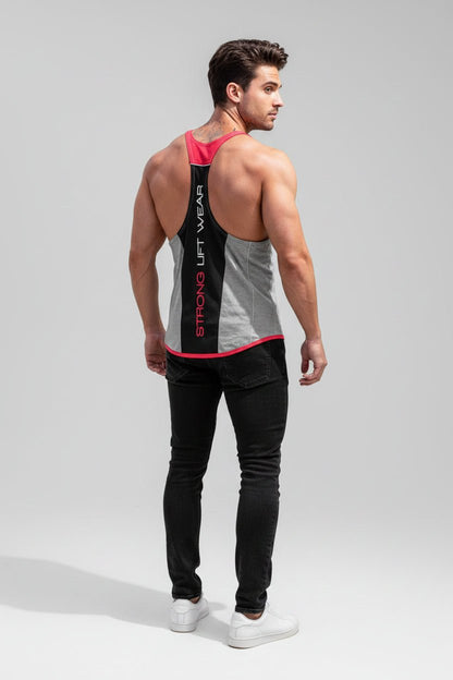 Man wearing a gray tank top with red accents and black pants on a light gray background
