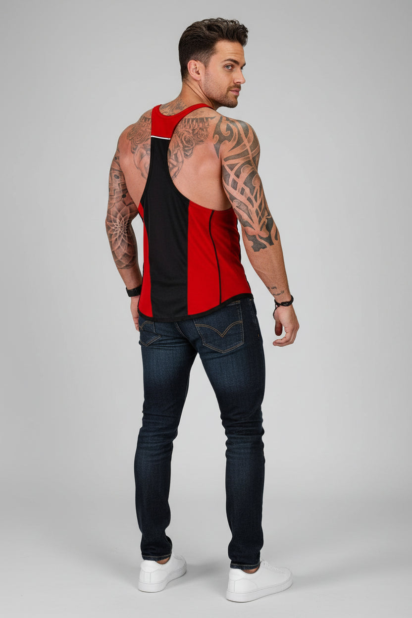 Man wearing a red and black sleeveless shirt with tattoos on a gray background