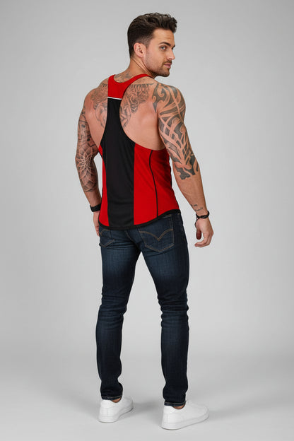 Man wearing a red and black sleeveless shirt with tattoos on a gray background
