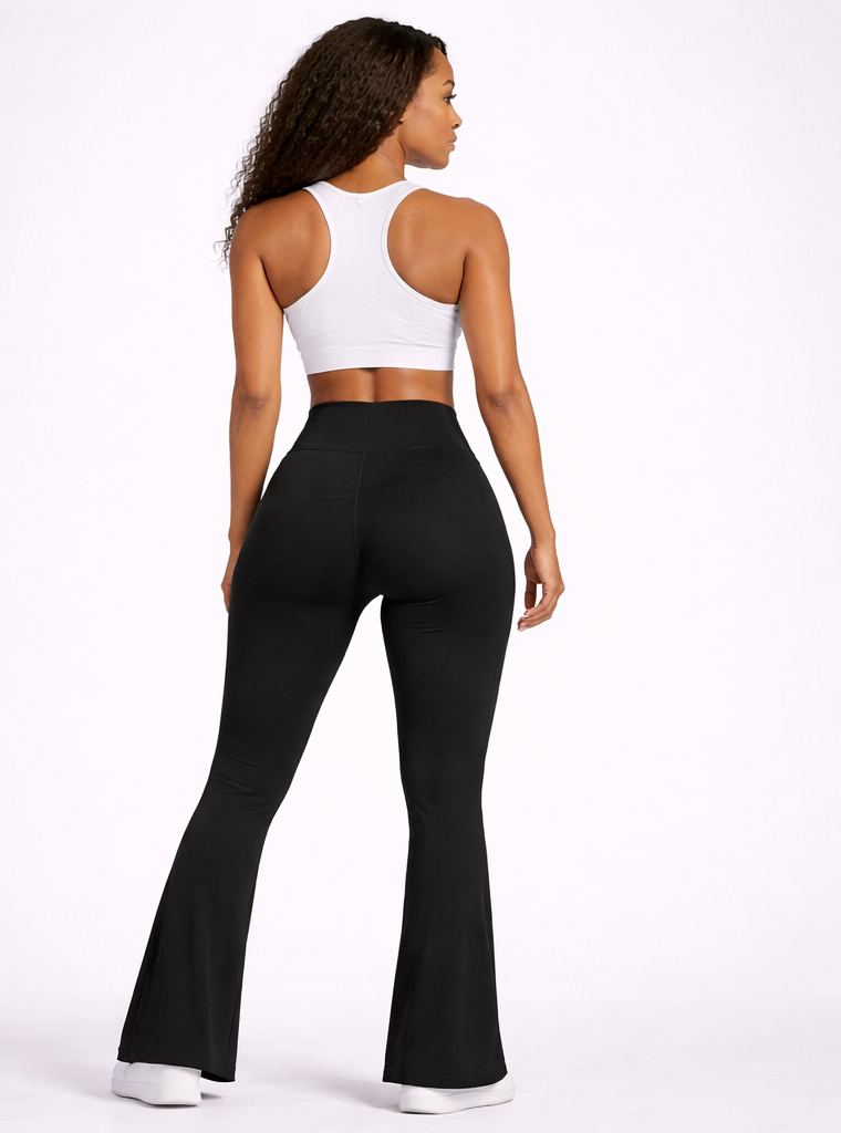 Person wearing a white sports bra and black flared pants on a white background - Aresfit