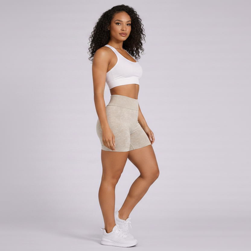 Woman wearing a white tank top and beige shorts on a gray background - Aresfit