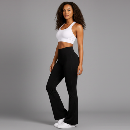 Woman wearing a white tank top and black high-waisted leggings on a white background - Aresfit