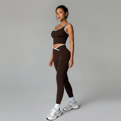 Woman wearing a brown athletic outfit with white sneakers on a gray background- AresFit