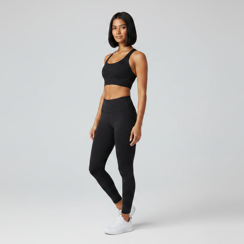 Black women’s cross back gym sports bra side profile with supportive fit - AresFit