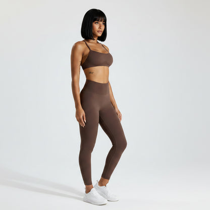 Women’s brown seamless cross back sports bra front view for gym workouts - AresFit