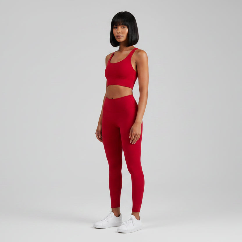 Women’s red cross back sports bra front view for fitness and cardio training - AresFit