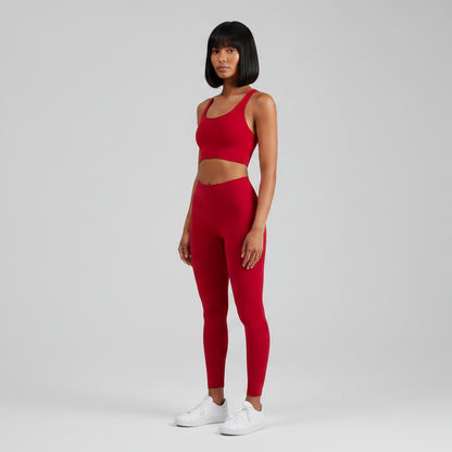 Women’s red cross back sports bra front view for fitness and cardio training - AresFit