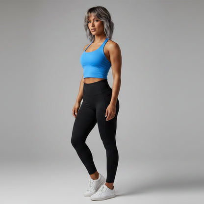 Angled view of women’s blue halter neck gym top with activewear fit - AresFit