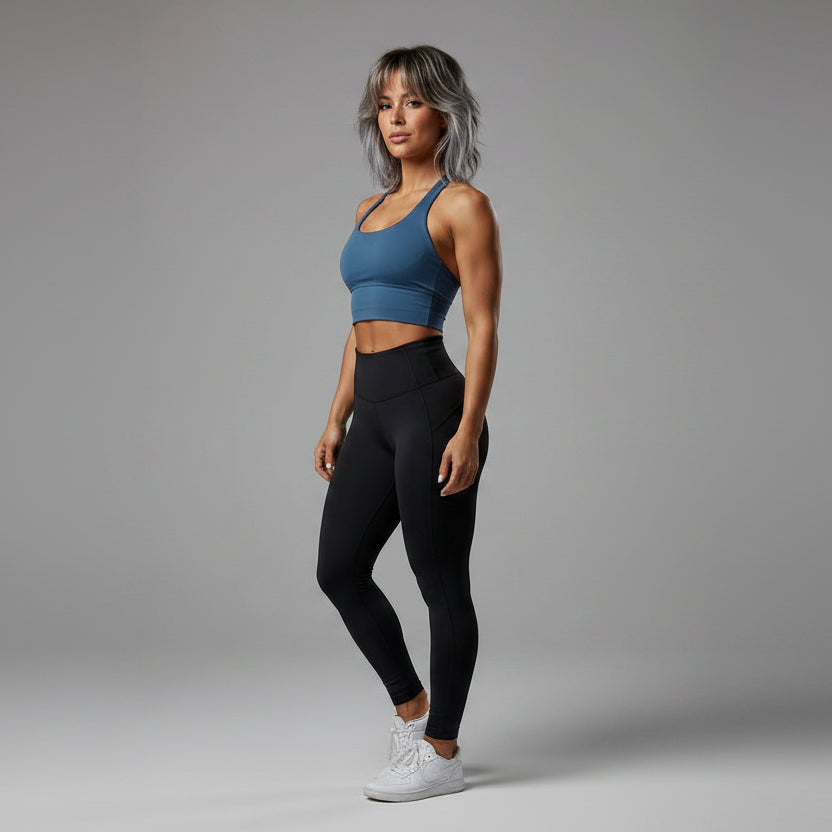Side view of women’s blue halter neck gym top with workout fit - AresFit