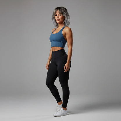 Side view of women’s blue halter neck gym top with workout fit - AresFit