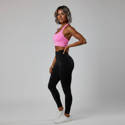 Side view of women’s pink halter neck gym top with stretch activewear fit - AresFit