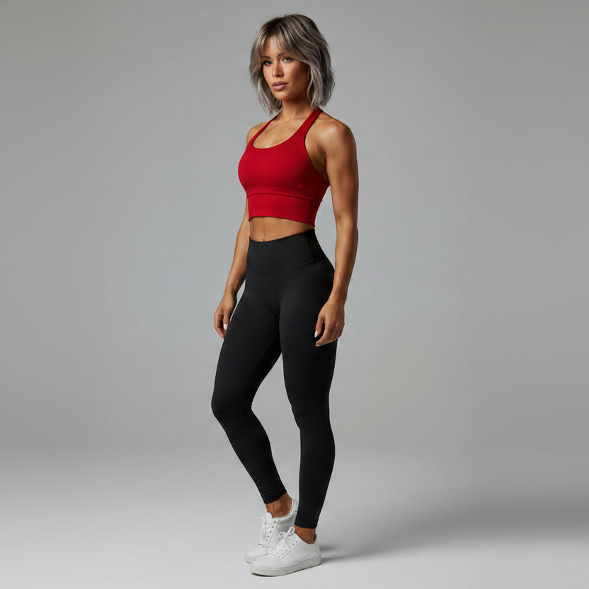Side view of women’s red halter neck gym top with workout activewear fit - AresFit