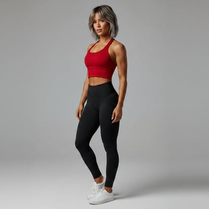 Side view of women’s red halter neck gym top with workout activewear fit - AresFit