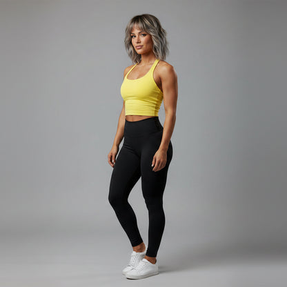 Women’s yellow halter neck gym top with fitted seamless activewear style - AresFit