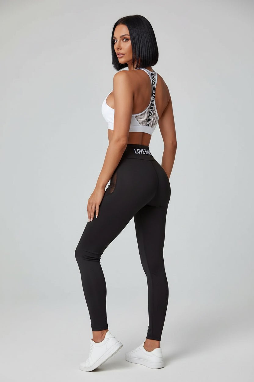 Black women’s sports bra angled side view with flexible supportive fit - AresFit