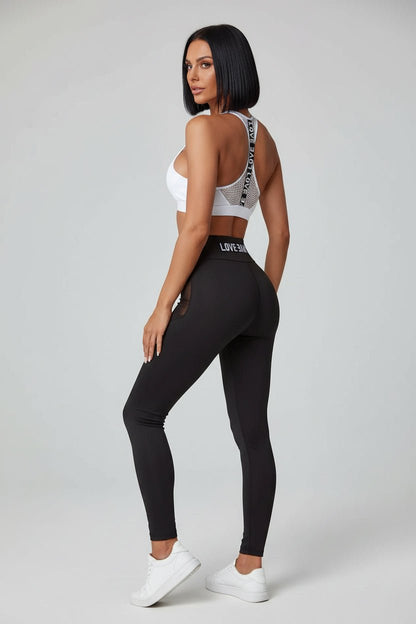 Black women’s sports bra angled side view with flexible supportive fit - AresFit