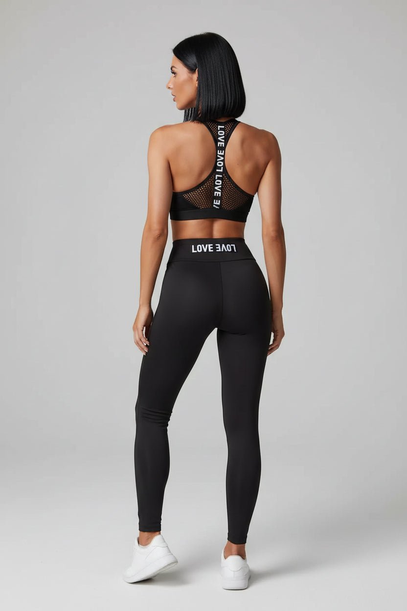 Black women’s running sports bra rear profile with racerback support design - AresFit