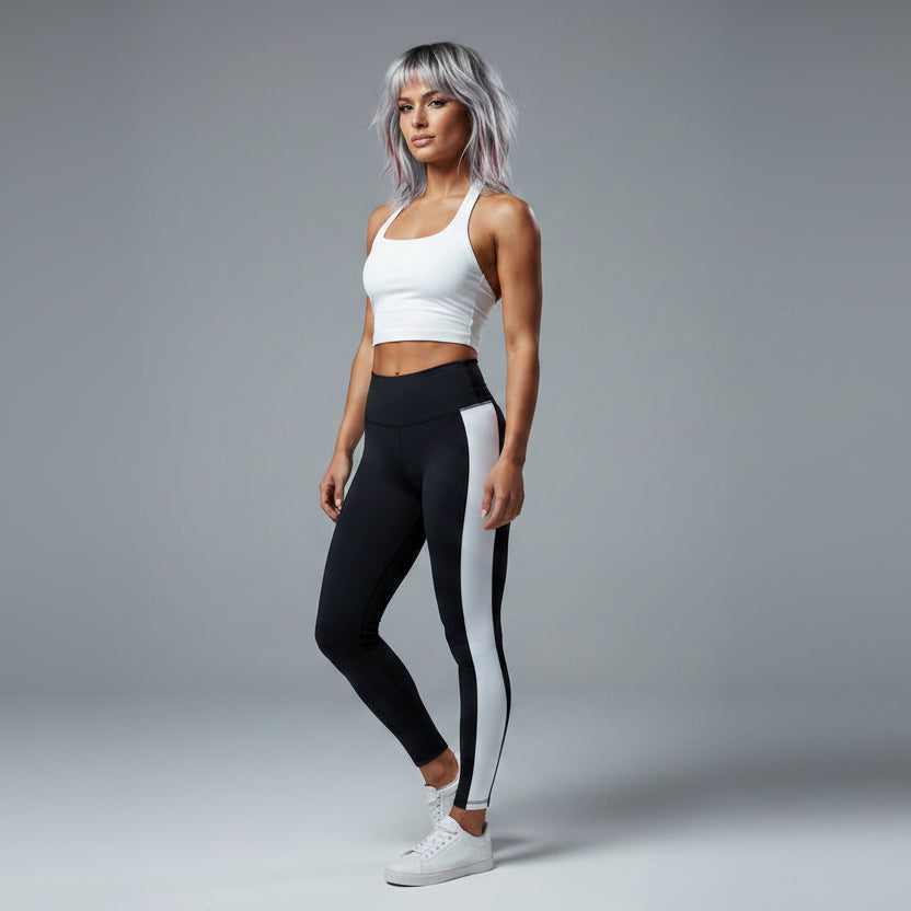 Side view of women’s white longline halter tank top with black leggings - AresFit