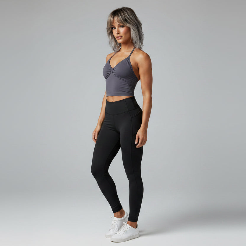Side view of women’s dark gray longline strappy tank top with slim fit - AresFit