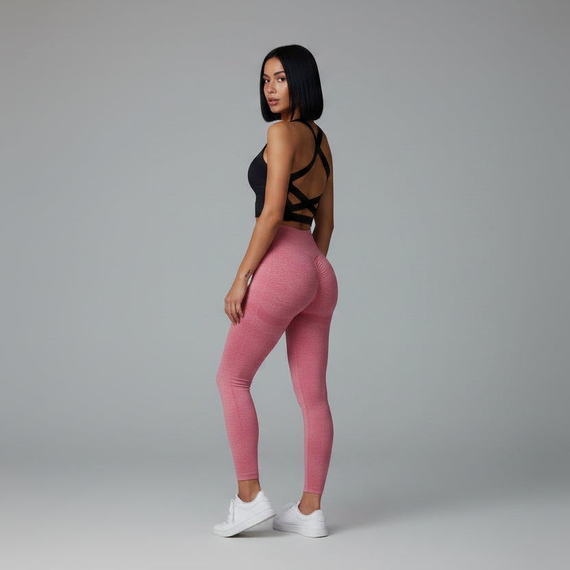Black women’s seamless sports bra back view with supportive cross strap design - AresFit