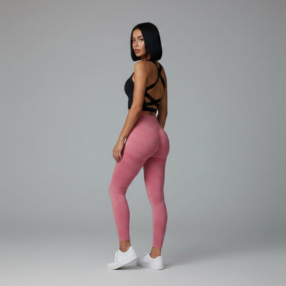 Black women’s seamless sports bra back view with supportive cross strap design - AresFit