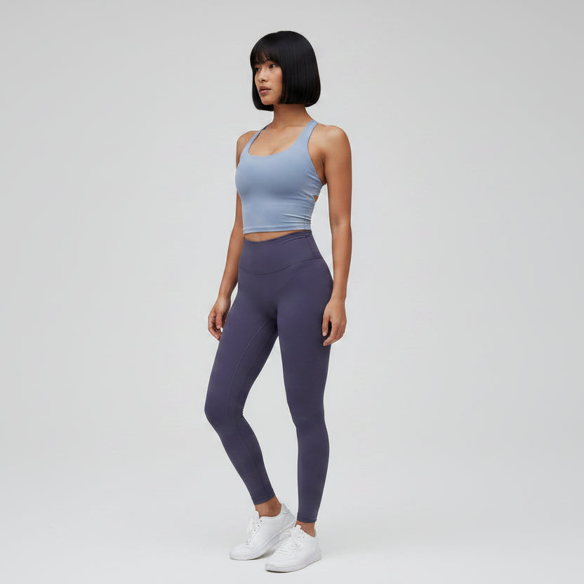 Gray women’s seamless cross back sports bra with breathable athletic fit - AresFit